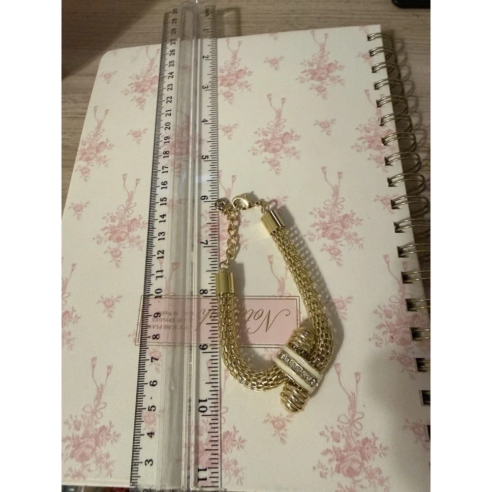 Gold Tone Mesh Knot Bracelet White Enamel Rhinestone Accents Adjustable Signed
